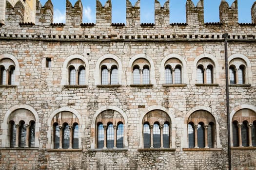 Detail of the facade of the Praetorian Palace in Duomo plaza, Trento, Italy.