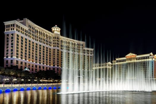 LAS VEGAS, NV/USA - FEBRUARY 13, 2016: Night music fountain at the The Bellagio hotel and casino on the Las Vegas Strip. The Bellagio is owned and operated by MGM Resorts International.