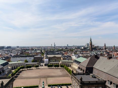 Copenhagen panoramic view from Amalienborg Palace and its square with roofs and buildings.