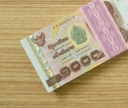 one Thousand  thai banknotes put on table .  money concept