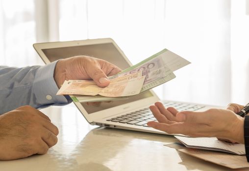 Businessmen are paying interest to the bank employees.