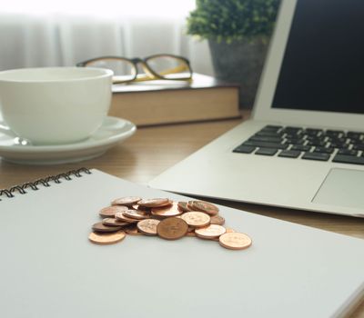 golden coins on office background. finance, business,retirement concept