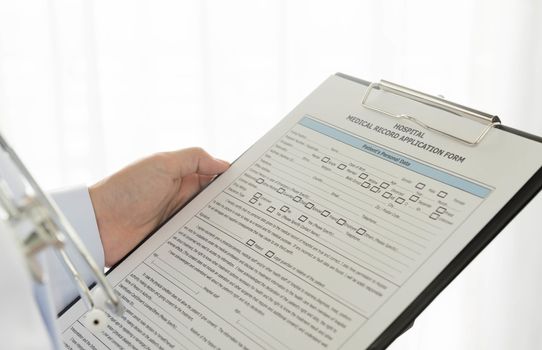 Medical documents in hand doctors on a white background.