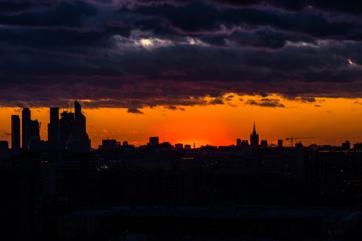 The photo depicts the silhouette of the city