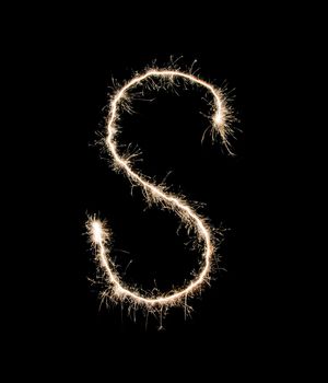 Letter S drew with spakrs on a black background.