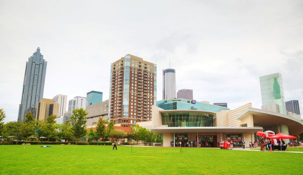 ATLANTA - AUGUST 29: World of Coca-Cola in Centennial Olympic park with people on August 29, 2015 in Atlanta, GA.