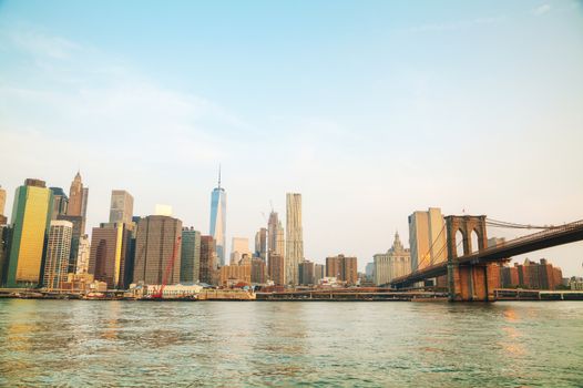 Lower Manhattan cityscape with the Brooklyn bridge in the evening