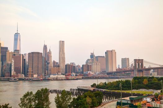 Lower Manhattan cityscape with the Brooklyn bridge in the evening