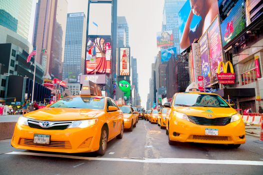 NEW YORK CITY - SEPTEMBER 04: Yellow cabs at Times square in the morning on October 4, 2015 in New York City. It's major commercial intersection and neighborhood in Midtown Manhattan at the junction of Broadway and 7th Avenue.