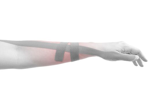 Kinesio tape on female hand isolated on white background. Chronic pain, alternative medicine. Rehabilitation and physiotherapy.