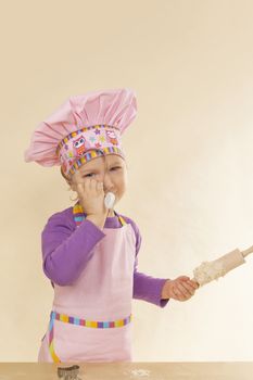 Cute little girl baking. 