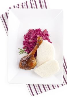 Delicious roast duck with red cabbage and dumplings. Traditional festive eating. 