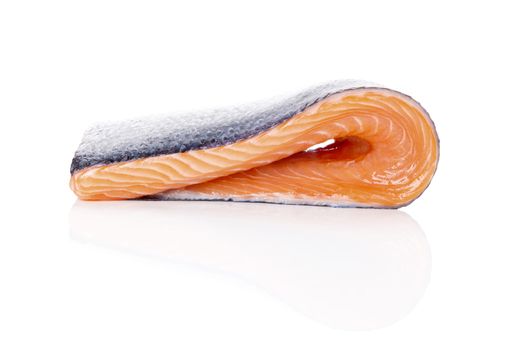 Raw salmon steak isolated on white background. Sashimi sushi. Luxurious healthy seafood eating. 