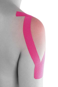 Kinesio tape on female shoulder isolated on white background. Rehabilitation and physiotherapy. 