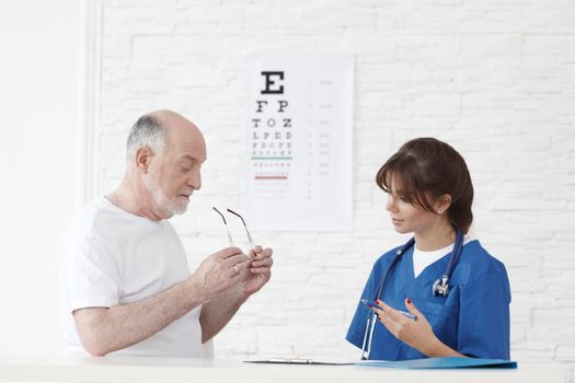 Doctor making vision test for new glasses