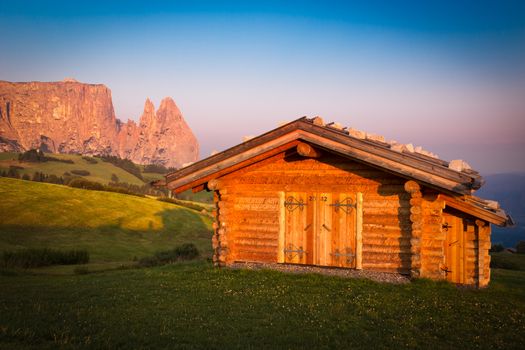 Cabin at Seiser Alm with Schlern mountain, South Tyrol, Italy