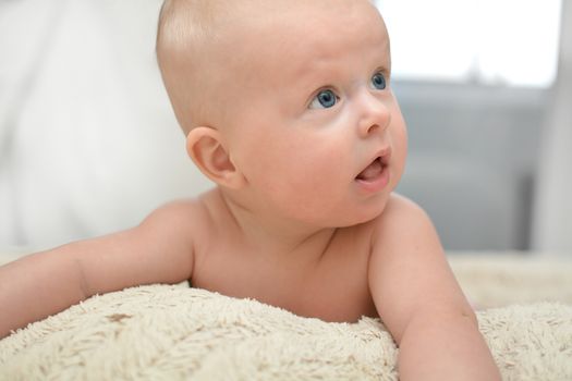 Blue  eyes Baby after bath on towel 