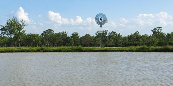 Windmill in the countryside of Queensland, Australia.