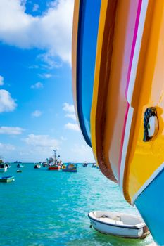 Abstract close up view of the vibrant colours and design usually used on the traditional Maltese fishing boat, the "Dghajsa" or "Luzzu".