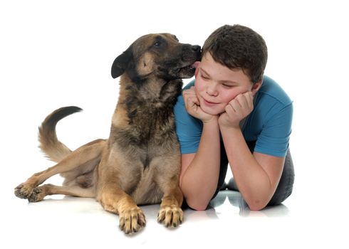 child and malinois in front of white background