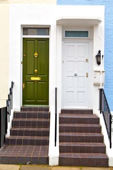 notting hill in london england old suburban and antique blue  wall door 