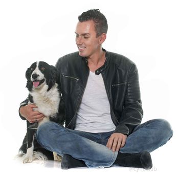 man and border collie in front of white background