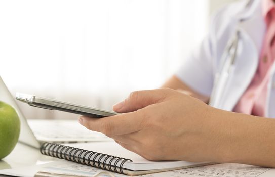 Doctors are using the smart phone to contact the patient.