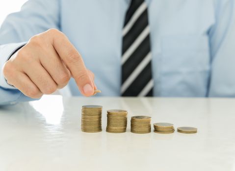 businessman putting golden coin. business concept, finance concept.