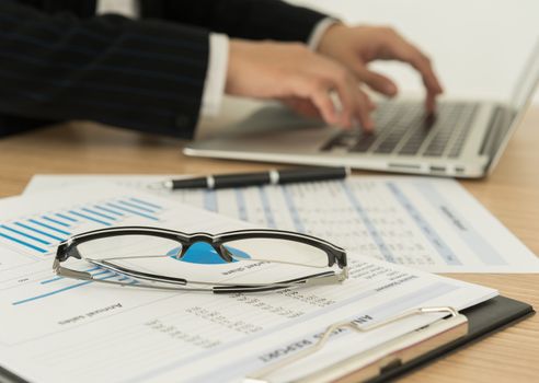Accountants are preparing a report to present to the executive.