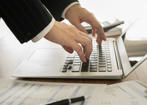 Accountants are saving the data into the computer.