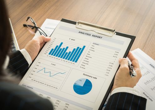 Businessmen are analyzing the data from the report.