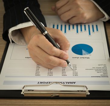Marketers are analyzing the data from the report to the marketing strategy.