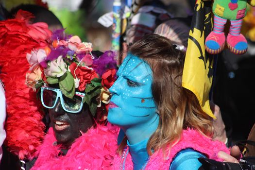 Nice, France - February 21, 2016: Woman Wearing an Avatar Neytiri Costume with Blue Face Paint in the Parade Float during the Carnival of Nice (Corso Carnavalesque 2016) in French Riviera. The Theme for 2016 was King of Media