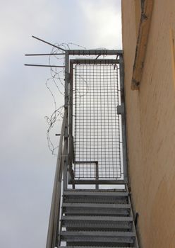 Secure Staircase with Metal Iron Grid and Barbed wire