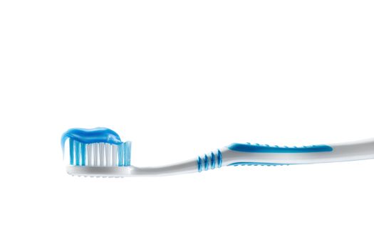 close up view of toothbrush  and some toothpaste on it on white back