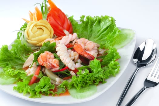 close up view of nice  shrimps  with vegetables on white back