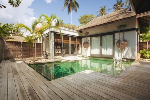 panoramic view of nice tropical villa with pool