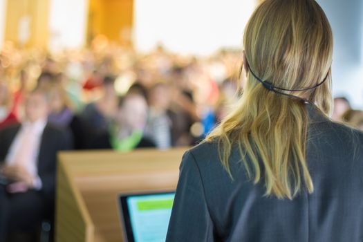 Female speaker at Business Conference and Presentation. Audience at the conference hall. Business and Entrepreneurship. Business woman.