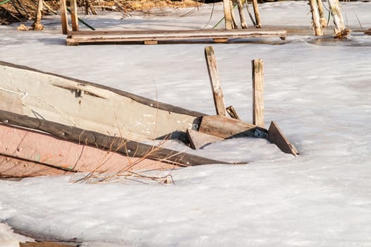 icebound old boat in the river during the day