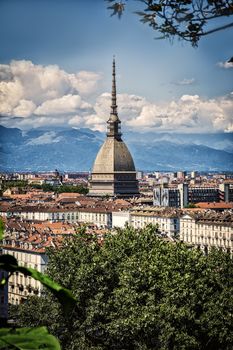 Panoramic view of Turin city center, in Italy, in a sunny day, with Mole Antonelliana and Alps in the background