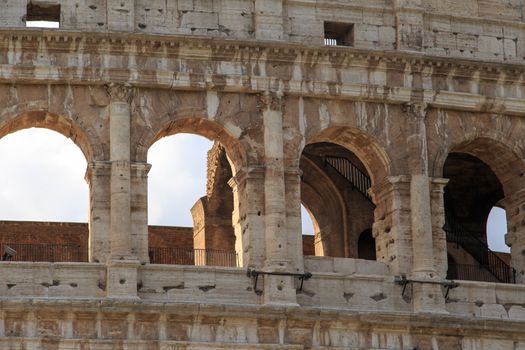 Close up detailed view of ancient amphitheatre of Colosseum built by Vespasian and Titus in Rome.