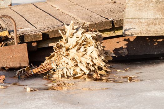 broom for a bath at the quay