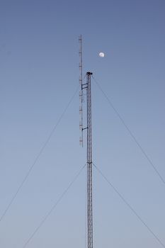 Crescent Moon over cellular antenna in thailand