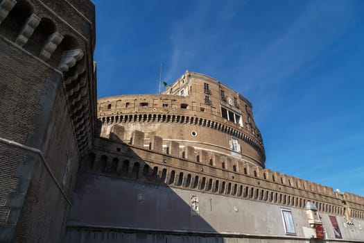 Close up detailed view of Castel Sant'Angelo, Castle of the Holy Angel built for Hadrian in Rome, on bright blue sky background.