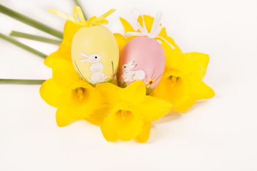 easter egg in spring flowers with background
