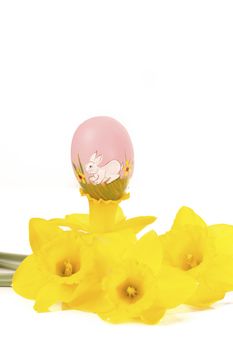 easter egg in spring flowers with background