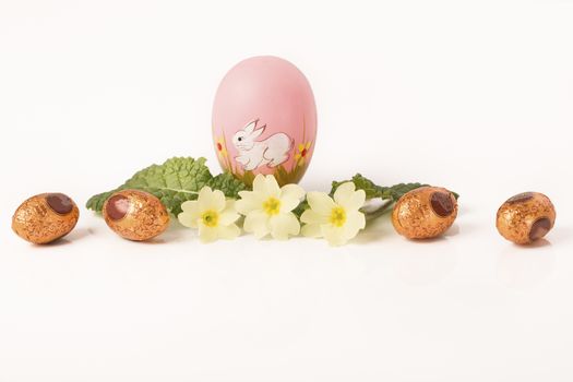 easter egg in spring flowers with background