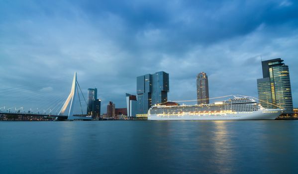 Twilight at Erasmus Bridge with Skyscraper in Rotterdam, The Netherlands.
