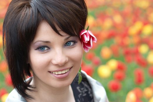 Pretty girl with tulips with soft background