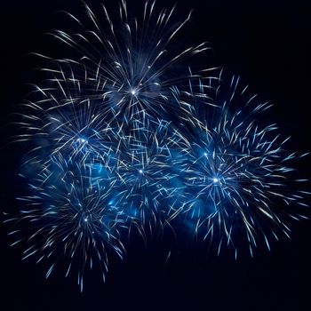 Blue fireworks on the black sky background